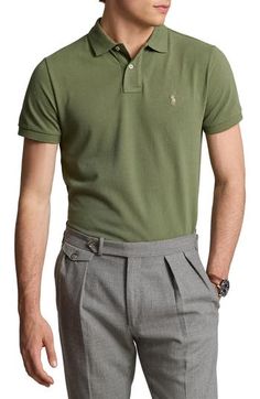 Cut from cool, breathable cotton piqué in a comfortably relaxed fit, this polo has been setting the brand's style standard since 1972. 28 1/2" front length; 29 1/2" back length (size Medium) Button half placket Spread collar Short sleeves 100% cotton Machine wash, dry flat Imported Classic Spring Polo Shirt For Golf, Classic Polo Shirt For Spring, Classic Green Polo Shirt For Work, Classic Green Polo Shirt With Relaxed Fit, Classic Green Polo Shirt For Workwear, Classic Relaxed Fit Polo Shirt For Golf, Green Cotton Polo Shirt For Work, Fitted Green Polo Shirt For Spring, Green Casual Polo Shirt For Work