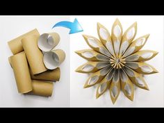 an origami flower made out of toilet paper and rolled up with blue tape