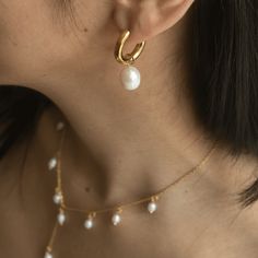 Meet our Becca Medium Pearl Hoops, a timeless and versatile piece. These classic chunky hoops feature a detachable freshwater pearl charm, making each piece truly unique with its own nuances, luster, tone, and shape. Crafted from jewelry-grade stainless steel, these hoops are hypoallergenic, tarnish-resistant, and waterproof, ensuring durability and comfort for everyday wear. Embrace the beauty of individuality! Details: Gold: 316L Stainless Steel, 18K Gold PVD Plated, Freshwater Pearls Silver: Classic Metal Pearl Earrings With Pearl Charm, Classic Everyday Pearl Earrings Tarnish Resistant, Modern Everyday Pearl Earrings, Classic Huggie Jewelry With Pearl Charm, Classic Everyday Pearl Earrings, Classic Tarnish-resistant Pearl Earrings For Everyday, Everyday Metal Hoop Earrings With Pearl Drop, Modern Hoop Jewelry With Pearl Charm, Modern Pearl Hoop Jewelry