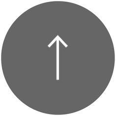 an arrow pointing up in the center of a gray circle with a white line on it