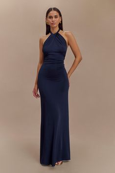 For the perfect guestThe ELYNA Slinky Halter Maxi Dress is the epitome of elegance and allure. Its halter neckline and ruched centre front exude sophistication, while the low back adds a touch of sultry charm. With ruched centre back detail, this dress offers a flattering silhouette from every angle. Designed to hug your curves, its bodycon fit accentuates your figure effortlessly. Perfect for any special occasion, the maxi length adds drama and elegance to your ensemble. Embrace timeless style Blue Halter Neck Dress, Debs Dresses, Navy Maxi Dress, Halter Neck Dress, Maxi Dress Sale, Capsule Outfits, Halter Maxi Dress, Halter Maxi, Maxi Dress Navy