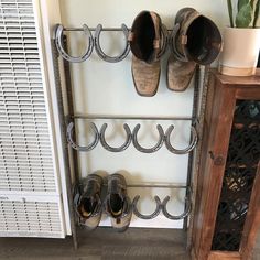 there is a shoe rack with several pairs of shoes hanging from it's sides