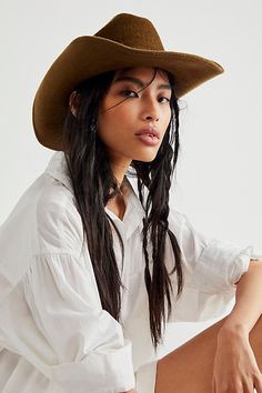 So chic western-inspired hat featured in a classic cowboy shaped silhouette with a cattleman crease crown, upturned brim, and interior ribbon adjuster for a so-perfect-fit. * Interior sweatband * Adjustable fit * Structured style | Cash Cowboy Hat by Wyeth at Free People in Brown Cowboy Hat Outfit Woman, Brown Cowboy Hat, Hat Aesthetic, Classic Cowboy, Black Cowboy, Western Hats, Outfits With Hats, Cool Hats, Wool Hat