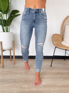 You will style comfortable and trendy all season long in the Maddie Jeans by Judy Blue! Features distressed detailing and rolled hemlines for a stylish and edgy look. They also feature a medium wash with a high-rise waistband and a zip and button closure. Perfect to pair with sweaters, blouses and tank tops! Everyday Ripped Washed Blue Bottoms, High Rise Medium Wash Jeans With Zipper Closure, Trendy Medium Wash Bottoms With Zipper Closure, High Rise Jeans With Zipper Closure In Medium Wash, Medium Wash Bottoms With Zipper Closure For Fall, Medium Wash High-rise Jeans With Zipper, High Rise Jeans With Zipper In Medium Wash, High Rise Jeans With Medium Wash And Zipper, Fall Medium Wash Bottoms With Zipper Closure