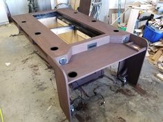 an unfinished desk in the process of being built