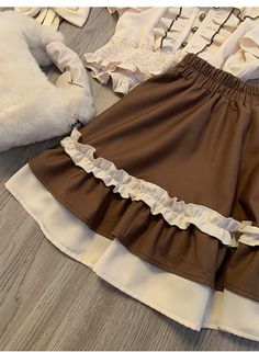 The price is for a skirt only, others are not included.   	 		 			Size 			S 			M 			L 			XL 		 		 			Waist 			62 			65 			68 			71 		 		 			Full Length 			38 			39 			40 			41 		 		 			Hem Circumference 			182 			186 			190 			194 Brown Ruffled Skirt For Summer, Brown Summer Skirt With Ruffles, Brown Ruffled Skirt For Spring, Brown Ruffled Flared Skirt, Brown Ruffled Tiered Mini Skirt, Brown Ruffled Bottoms For Spring, Summer Flared Mini Skirt In Brown, Brown Flared Mini Skirt For Summer, Spring Brown Skirt With Ruffles