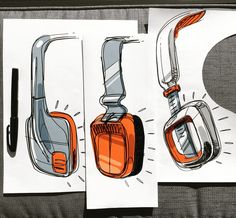 three drawings of headphones on top of each other next to a pen and paper