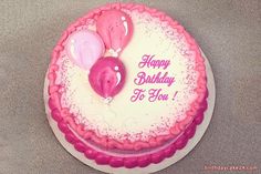 a birthday cake with pink and white frosting, balloons in the shape of hearts