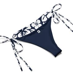 Indulge in the luxurious and exclusive style of our White Hawaiian Flowers on Navy Blue String Bikini. This beautiful string bikini set is not only comfortable, but it also offers double-layering and UPF 50+ protection. Customize the straps to your liking and get ready to turn heads at the beach! Made from soft recycled polyester, this bikini is both stylish and sustainable. • Soft and stretchy material with UPF 50+• Sizes up to 6XL• Bikini top comes with removable padding for comfort• Multiple Adjustable String Swimwear For Pool, Beach String Swimwear With Adjustable Straps, Beach Swimwear With Adjustable String Straps, Beach Swimwear With Adjustable Straps, Beach Swimwear With Adjustable Straps And String Shape, Blue String Swimwear For Swimming, Blue String Beachwear Swimwear, Blue String Swimwear For Beach, Blue String Swimwear For Beachwear