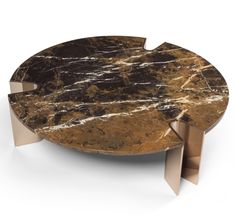 a marble coffee table with metal legs and an oval shaped design on the top, against a white background