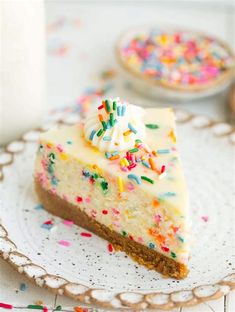 a slice of cake on a plate with sprinkles