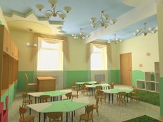 an empty classroom with green and white walls, tables and chairs in the middle of the room