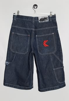 "Karl Kani jean shorts, with brand logo embroidery in red on the back pocket. - Size tag: Please always check measurements before buying. Tag reads size 30, Men's S - Measurements (laying flat): Waist: 15.5\" Outleg: 26\" Inleg: 14\" Thigh: 13.5\" Rise: 13\" Leg opening: 11.5\" -Wear: /Please see images for details/ Good vintage condition. The leather tag on the back is peeling. - Fabric: 100% Cotton *All of our items are preloved pieces so some signs of natural wear and age are to be expected. Please look through the photos carefully to check if the condition is to your satisfaction.  *All efforts are made to show any defects however small imperfections may be missed. In cases that we've missed a major flaw, please remember that we are still human and make mistakes, please contact us firs Denim Blue Streetwear Shorts With Side Pockets, Streetwear Shorts With Five Pockets, Five-pocket Streetwear Shorts, Dark Wash Jean Shorts For Streetwear, Streetwear Jean Shorts With Hip Pockets, Hip Pocket Jean Shorts For Streetwear, Dark Wash Shorts With Pockets For Streetwear, Dark Wash Jean Shorts With Pockets For Streetwear, Dark Wash Five-pocket Shorts For Streetwear