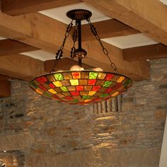 a stained glass chandelier hangs from the ceiling