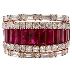 This is an exquisite ruby and diamond band that will go with any outfits. It's the perfect smart casual band with the channel set ruby baguettes in the the middle with round and baguette diamonds on the shoulders. Size: 6.25 (can be resize) Ruby: 1.27 cts, Baguette Diamonds: 0.45 cts, Round Brilliant / Baguette Metal: 18k Rose Gold