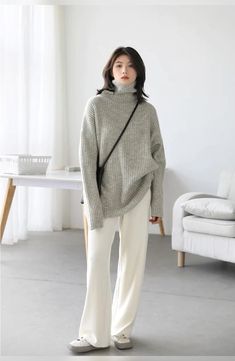 The Oversized Turtleneck Solid Loose Sweater is the epitome of cozy-chic fashion. With its relaxed, roomy fit and high turtleneck collar, it offers both comfort and style in one versatile package. Crafted in a single, solid color, it's a minimalist's dream, easily paired with a variety of outfits. Whether you are lounging at home or stepping out on a crisp day, this sweater keeps you warm, fashionable, and effortlessly comfortable.