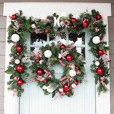 a wreath on the front door decorated for christmas