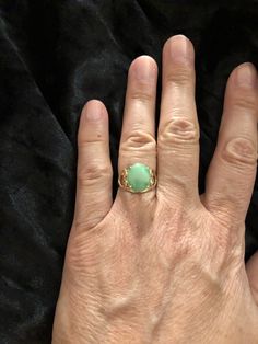 Vintage Solid 14K Yellow Gold Green Jade Heart Design Ring Sz 5 3/4: (In wonderful estate condition) Lovely ring, crafted in solid 14K gold with natural Green Jade and heart shank design, gorgeous! Thank you for your interest and please be sure to see our other listings for more great Jewelry, books and collectables. Want to shop for more items with us here on Etsy? Here is the link: https://www.etsy.com/shop/Shelleyscollectibles?ref=hdr_shop_menu Elegant Green Opal Ring In 14k Gold, Classic Green Opal Ring In 14k Gold, Gold Heart Ring With Oval Gemstone, Gold Heart Ring With Gemstone, Classic Gold Rings With Jade, Yellow Gold Oval Heart Ring With Gemstone, Heirloom Jade Rings In Yellow Gold, Elegant Green Hallmarked Opal Ring, Elegant Gold Opal Ring For May Birthstone