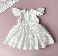 Baptism Dress With Short Sleeves.  This dress is made of natural cotton and elegant floral lace. The colour is ivory.  The inside of the dress is lined of natural cotton so your baby girl will feel comfortable. It has a cozy zipper in the back. Choose from size newborn  to 3T.  Please, check attentively all your measurements at the size chart  on the second photo. If you have specific requests, our team is happy to create a custom dress for you. You can order all the matching outfit: bonnet, headband, booties, bloomers, blanket. Link for : *bonnet: https://www.etsy.com/listing/785768002/baptism-bonnet-lace-bonnet-baptism-baby?click_key=0901abbc1c12db427f8509d71a98750c1773883c%3A785768002&click_sum=cecc4772&ref=shop_home_active_4&frs=1&sts=1 *headband: https://www.etsy.com/listing/140976942 Outfit Bonnet, Girl Baptism Dress, Christening Blanket, Girls Baptism Dress, Dress For Baby Girl, Lace Bonnet, Girl Baptism, Beautiful Museum