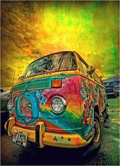 an old vw bus painted in rainbow colors