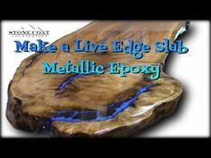 a live edge slab with metallic epoxy inlaying the top and bottom