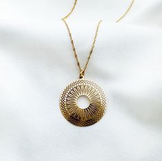 "Wonderful filigree necklace with beautifully cut-out round pendant. Wear it alone as long necklace or layer it with other necklaces from my collection. This elegant  delicate Gold medallion necklace   necklace is perfect for great look. Geometric jewelry, available as earrings and in sterling silver 925 https://www.etsy.com/listing/776876665/circle-medallion-necklace-in-sterling?click_key=03d4c6849a31ffe370f654ec2faefbc1b482e9a6%3A776876665&click_sum=623843e5&ga_search_query=sun&ref=shop_items_ Gold Medallion Necklace With Sun Design, Gold Necklace With Sun Design Round Pendant, Gold Sun Design Round Pendant Necklace, Gold Medallion Necklace, Sun Necklace, Filigree Necklaces, Gold Medallion, Filigree Pendant, Round Necklace