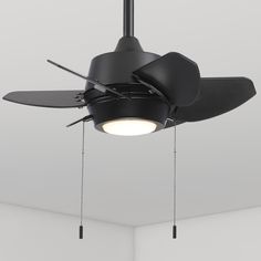 a black ceiling fan with two blades hanging from it's center and one light on the other side