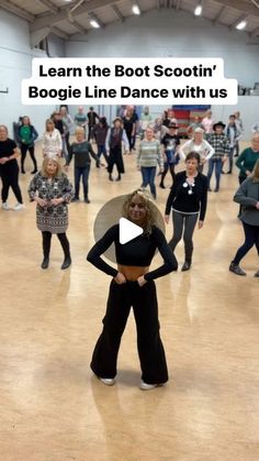 a group of people dancing in a large room with text that reads learn the boot scooter boogie line dance with us