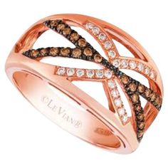 a rose gold ring with brown and white diamonds on it's sides, set in 18k pink gold