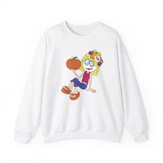 Description: Rediscover the charm and whimsy of Lizzie McGuire with a festive twist! Our exclusive Halloween Candy Skull Lizzie McGuire cartoon sweatshirt is the perfect blend of nostalgia and Halloween fun, making it a must-have addition to your festive wardrobe. Product Details: Design: Our sweatshirt features a unique cartoon illustration of Lizzie McGuire painted as a candy skull, capturing her playful spirit and Halloween flair in every detail. This design pays homage to the beloved charact Playful White Sweatshirt With Character Print, White Cartoon Tops With Character Print, White Cartoon Style Tops With Character Print, White Cartoon Character Print Tops, Fun Cartoon Print Sweatshirt, Lizzie Mcguire Halloween, Candy Skull Art, Lizzie Mcguire Cartoon, Nostalgic Halloween