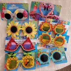 several pairs of sunglasses with flowers on them