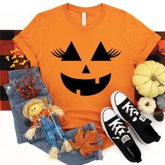 Lashes Pumpkin Face Shirt - Female Pumpkin Shirt - Halloween Shirt - Graphic Tee - Jack O Lantern - Cute Fall Shirts - Fall Shirts For Women Shirt shown was made with our Orange Bella Canvas Shirt Shirt will be made with graphic as shown, in black Design Size: 11.94 x 10.94 **Shirt Colors** Autumn Carolina Blue Clay Grey Maroon Mauve Mustard Navy Orange Peach Pink Purple Raspberry Red Sand Teal White *Shirt Details* Bella Canvas 4.2 oz. 52% airlume combed and ringspun cotton, 48% polyester, 32 singles (approx) may vary Shoulder taping Unisex sizing Side-seamed Pre-shrunk Retail fit Tear away label *Sizes* S M L XL XXL Brand and color may vary slightly Cheap Orange Shirt For Halloween, Halloween Shirts Kids, Jack O Lantern Faces, Blue Clay, Screen Print Transfer, Halloween Graphic Tees, Pumpkin Face, Print Transfer, Pumpkin Faces