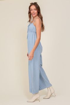 THE PERFECT MIX OF FLIRTY AND FUN, THIS JUMPSUIT IS READY FOR ANY SUMMER OCCASIONS. THE FLOWY SILHOUETTE IS COMPLEMENTED BY A SQUARE NECK LINE, RUCHED BUST, AND FRONT KEYHOLE DETAILS. WHETHER YOU ARE SIPPING COCKTAILS OR DANCING THE NIGHT AWAY, THIS DENIM BLUE JUMPSUIT WILL HAVE YOU FEELING THE BEST.* SLEEVELESS DESIGN* SPAGHETTI STRAP* SELF FRONT TIE* FRONT KEY HOLE* LIGHTWEIGHT MATERIAL* THE MODEL IS 5'9" AND WEARING SIZE SMALLMade In: ChinaFabric Contents: 90% cotton 10% viscoseSize Measureme Light Blue Relaxed Fit Denim Top For Summer, Light Blue Cotton Summer Jumpsuits And Rompers, Light Blue Cotton Summer Jumpsuit, Indigo Denim Top For Summer, Summer Indigo Denim Top Relaxed Fit, Chic Light Wash Cotton Jumpsuits And Rompers, Light Blue Cotton Jumpsuits And Rompers For Summer, Blue Chambray Denim Dress - Relaxed Fit, Trendy Light Wash Jumpsuits And Rompers For Spring