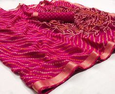 This Saree is Ready to Wear (With Fall and Pico Done). A designer saree in magenta with intricate golden designs and border. This saree is a suitable amalgamation of style and grace that is required from an ethnic wear. The saree is ideal for any formal gathering. The saree comes with an unstitched blouse of corresponding color and design as shown in the picture. Sari Chiffon, Saree Casual, Gotta Patti, Bandhani Saree, Chiffon Saree, Style And Grace, Printed Sarees, Wedding Wear, Saree Collection