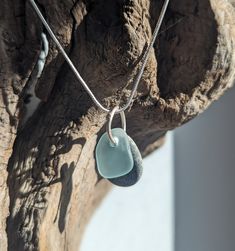 Best way to celebrate spring and summer?  Wearing a bit of the beach daily. Beach glass and pebble pendant.  Simple and lovely, natural and organic.  The pale light blue glass catches the light, against the matte gray oval stone.  Hand-forged sterling jump ring. Great for any age, any gender. Minimalist Handmade Necklace With Recycled Glass, Minimalist Handmade Necklaces With Recycled Glass, Ocean-inspired Silver Glass Necklace, Ocean-inspired Silver Glass Jewelry, Silver Ocean-inspired Necklace With Recycled Glass, Ocean-inspired Silver Necklace With Recycled Glass, Pebble Pendant, Pebble Necklace, Oval Stone