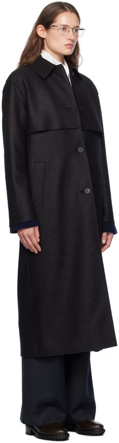 Mulesing-free virgin wool melton coat. · Spread collar · Button closure · Storm flap at front and back · Welt pockets · Raw edge at cuffs · Partial polar fleece lining Supplier color: Black Modern Black Outerwear With Button Cuffs, Navy Wool Coat With Buttons, Black Pea Coat For Workwear With Button Cuffs, Black Pea Coat With Button Cuffs For Work, Winter Wool Outerwear With Button Cuffs, Winter Wool Coat With Button Cuffs For Office, Wool Outerwear With Button Cuffs For Winter, Black Pea Coat For Work, Winter Office Pea Coat With Concealed Placket