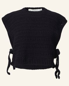 a black knitted top with ties on the front and shoulder, made out of yarn