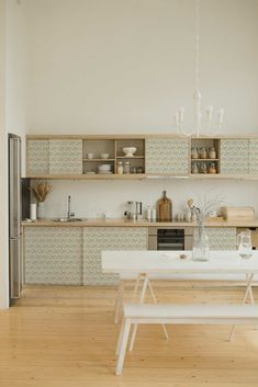 a white table and some shelves in a room