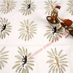 a table cloth with an image of a man riding a horse and buggy on it