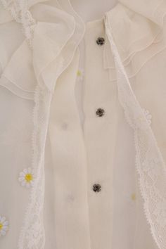 Dolce & Gabbana Gorgeous brand new with tags, 100% Authentic DOLCE & GABBANA white with daisy applique silk shirt blouse. Model: Long sleeve blouse shirt Collection: SICILY Color: White with yellow daisy Front button closure and button cuff Logo details Made in Italy Material: 100% Silk Luxury Blouse With Lace Trim, Luxury Long Sleeve Tops With Lace Trim, Designer White Short Sleeve Blouse, Designer Shirt For Spring Party, Luxury Long Sleeve Spring Blouse, Designer Shirt For Party In Spring, Luxury Long Sleeve Blouse For Spring, Designer Spring Party Shirt, Luxury Summer Blouse For Daywear