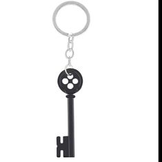 a key chain with a black and white design on it