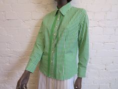 "Salad Green White Gingham Plaid Womens Shirt Plaid Dirndl Blouse Long Sleeves Buttons up Blouse Trachten German Oktoberfest Medium Size Label size: EUR 40 Measurements (laying flat): Length- 24.5\" / 62.5cm Bust - 20\" / 51cm Waist - 17.5\" / 44.5cm Sleeve - 22.5\" / 57cm Shoulders - 15\" / 38cm Please check measurements to insure a proper fit. Remember to allow yourself some extra room for movement. You can compare these with something from your closet that fits you well. Condition: good Vinta Fitted Plaid Shirt For Spring, Fitted Gingham Tops For Daywear, Vintage Gingham Blouse For Spring, Fitted Plaid Preppy Shirt, Fitted Gingham Shirt For Spring, Spring Gingham Fitted Shirt, Spring Vintage Gingham Blouse, Retro Gingham Blouse For Spring, Fitted Gingham Blouse For Daywear