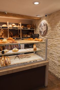 a bakery filled with lots of bread and pastries