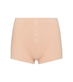 For loungewear with a touch of vintage inflection, look no further than these peach-pink shorts from Live The Process. Ribbed-knit to mold to the body for a close, comfortable fit, they're framed with tonal covered buttons. Style yours with the label's coordinating crop top. Ribbed Short Leg Loungewear Bottoms, Ribbed Loungewear Bottoms With Short Legs, Ribbed Summer Shorts With Short Legs, Ribbed Summer Shorts, Ribbed Loungewear Shorts, Beige Shorts For Loungewear, Spring Ribbed Shorts, Ribbed Bottoms For Summer Lounging, Summer Ribbed Bottoms For Lounging