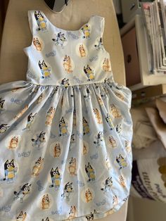 Bluey dress Cotton Cute Fitted A-line Dress, Cute A-line Dress For Casual Wear, Lined A-line Sundress, Light Blue Lined Midi Dress, Cute Fitted Light Blue Dress, Light Blue Fitted Cute Dress, Blue Fitted Sleeveless Dress For Dress-up, Cotton Lined Sundress, Lined Cotton Sundress