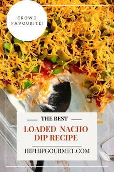 the best loaded nacho dip recipe in a casserole dish with text overlay