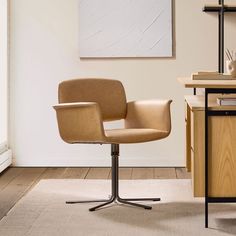 an office chair sitting on top of a wooden desk