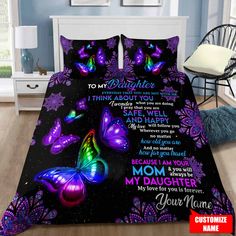 a bed with purple butterflies and the words to my granddaughter on it in front of a blue wall