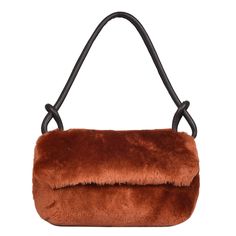 Super luxurious statement sheepskin bag our Whitby, shown here in Burnt orange shearling that oozes quality. Lightweight, Lined with extra large leather zipper internal pocket.  The deluxe leather handle, generously proportioned for your comfort, accommodates even the chunkiest winter coats, allowing you to carry Whitby in style effortlessly. The interior of Whitby is lined with our classic British cotton twill fabric, showcasing both durability and sophistication. 100% sheepskin. made in Englan Brown Leather Bags For Winter, Luxury Faux Fur Shoulder Bag For Everyday Use, Luxury Sheepskin Bags With Faux Fur Lining, Leather Evening Bags For Winter, Winter Sheepskin Rectangular Bag, Winter Rectangular Sheepskin Bags, Fall Brown Shoulder Bag With Faux Fur Lining, Brown Shoulder Bag With Faux Fur Lining For Fall, Luxury Leather Shoulder Bag With Faux Fur Lining