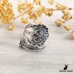 Immerse yourself in the charm of British-inspired motifs with this exquisite ring, crafted from a Victorian-era spoon. The original pattern, created by Whiting at the turn of the century, is known as Pompadour and exudes timeless elegance. This unique and detailed ring is a perfect gift for anyone who appreciates vintage style and the intricate craftsmanship of bygone eras. Whether worn as a statement piece or as a meaningful tribute to history, this ring is sure to captivate with its rich herit Unique Antique Silver Engraved Gift Ring, Unique Antique Silver Engraved Ring For Gift, Antique Silver Vintage Engraved Ring As Gift, Vintage Antique Silver Engraved Ring For Gift, Vintage Antique Silver Engraved Ring As Gift, Vintage Engraved Ring In Antique Silver For Gift, Heirloom Handmade Antique Silver Rings, Antique Silver Heirloom Ring Gift, Antique Silver Heirloom Ring As Gift